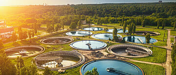 Aerial view of modern industrial sewage treatment plant at sunset