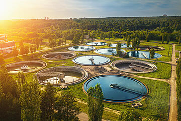 Aerial view of modern industrial sewage treatment plant at sunset